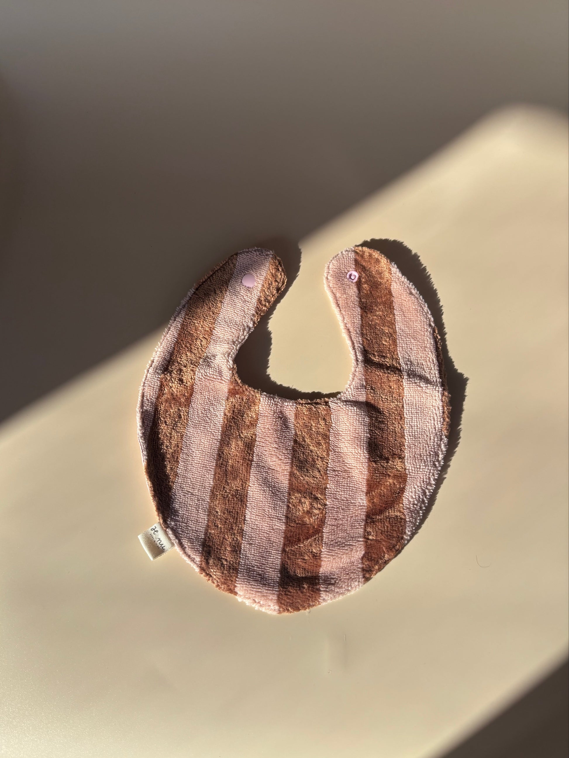 Babero rayas rosa y marrón